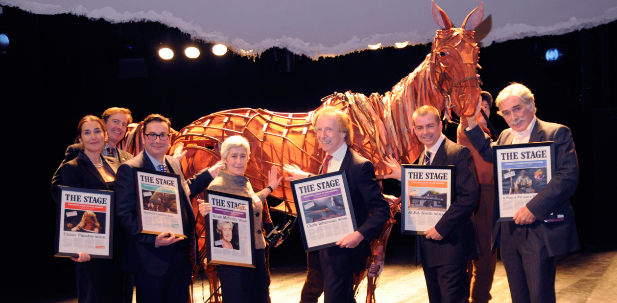 Stage Award winners earlier this year (l-r) Sasha Regan, Neil Constable, Dan Bates, Anne McNulty,   Chris Isherman, Adrian Hall and David MacLennan with the star of War Horse, Joey. Photo: Stephanie Methven