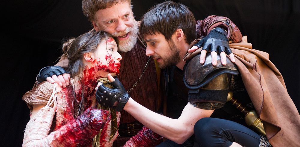 Flora Spencer-Longhurst (Lavinia),  William Houston (Titus) and Dyfan Dwyfor (Lucius)  in Titus Andronicus. Photo: Tristram Kenton