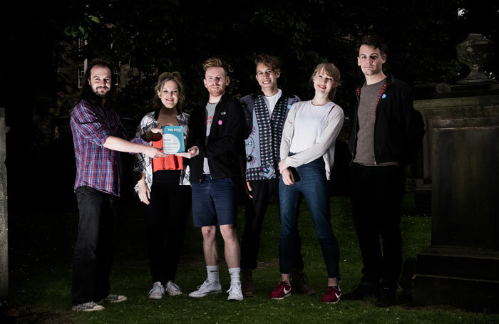 The Stage reviewer Stewart Pringle (left) presents members of Kill the Beast with their award. Photo: Alex Brenner