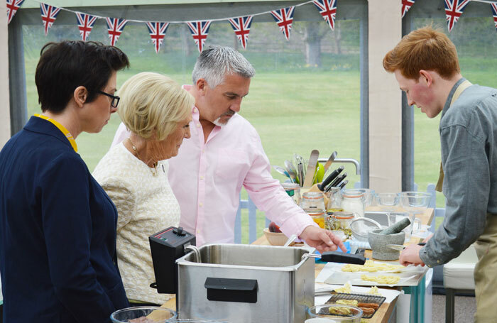 Sue Perkins, Paul Hollywood and Mary Berry and a contestant in The Great British Bake Off on BBC. Photo: BBC/Love Productions