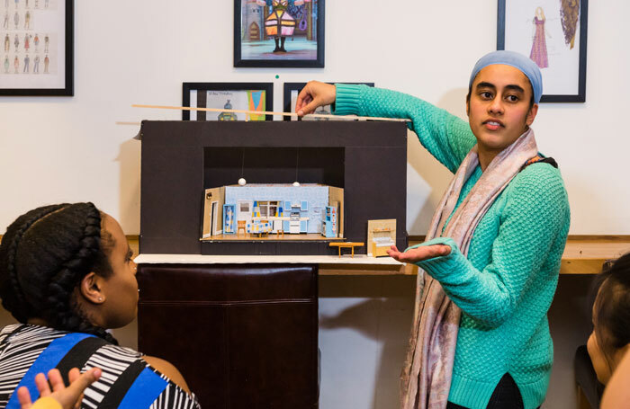 A designer giving a model-box presentation. Photo: Alex Brenner