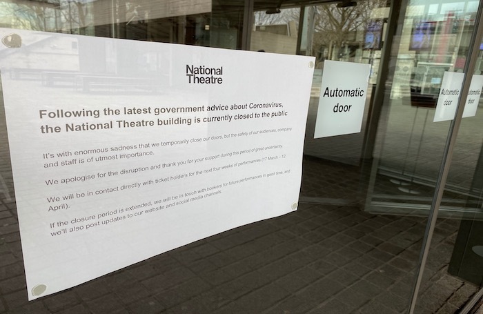 A notice about coronavirus issued by the National Theatre in London. Photo: Alistair Smith