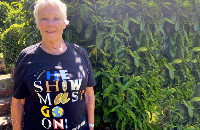 Judi Dench wearing a ‘The Show Must Go On’ T-shirt