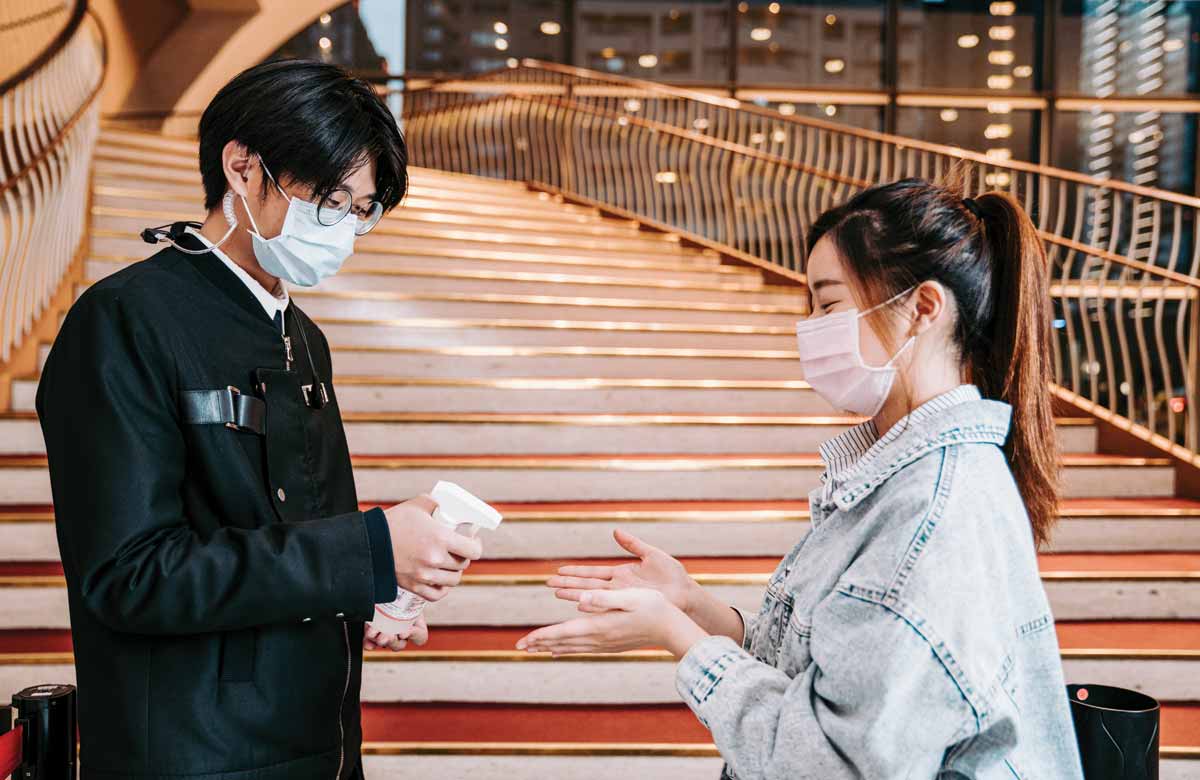 An audience member is given hand sanitiser when entering Taiwan’s National Taichung Theater