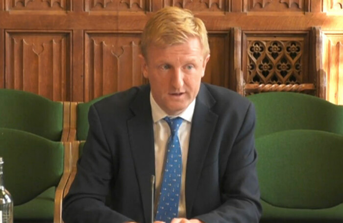 Oliver Dowden fielding questions at the committee hearing