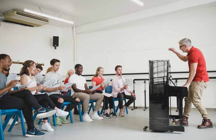 Chris Whitehead leads ArtsEd students in a singing class. Photo: Robin Savage