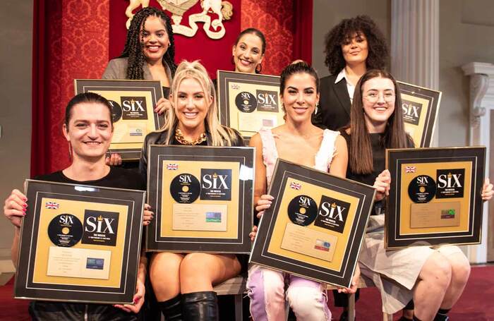 Members of Six's original cast with gold discs to mark 100,000 sales of the musical's album