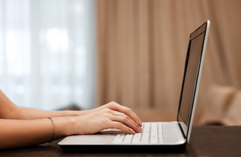 Writing woman writer women author playwright laptop computer Photo: Shutterstock