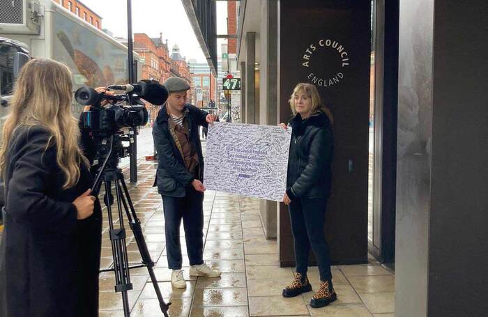 Equity president Lynda Rooke and campaigns officer Gareth Forest hand the petition to save Oldham Coliseum over to Arts Council England