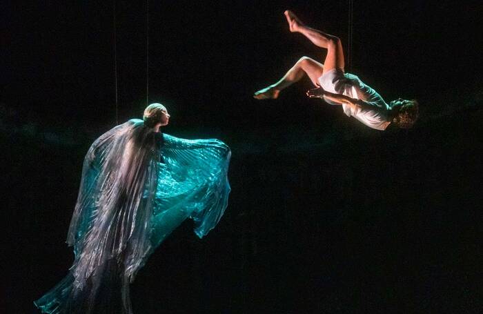 Aerialists Jamie Higgins and Becky Scarrott (doubling for the lead singers) in Rusalka at the Royal Opera House, London. Photo: Tristram Kenton