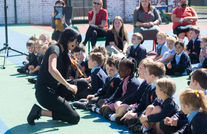 Children watching a Playground Proms performance. Photo: Alexandra Kenyon