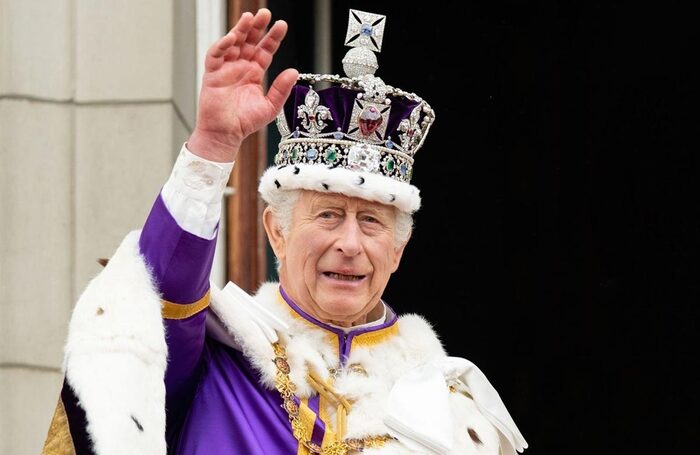 King Charles III on the balcony of Buckingham Palace following the Coronation on May 6, 2023. Shutterstock