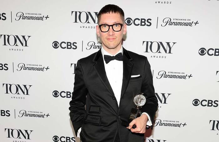 Tom Scutt poses with the best scenic design in a musical award for Cabaret at the Kit Kat Club at the 77th Annual Tony Awards. Photo: Getty