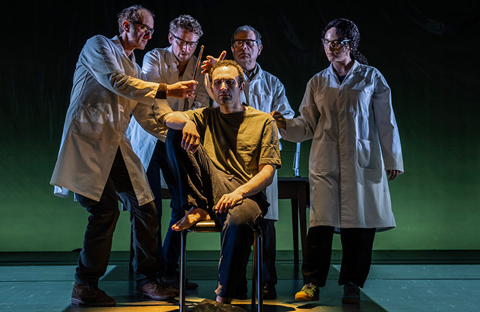 Khalid Abdalla (centre) in Mnemonic at the National Theatre. Photo: Johan Persson