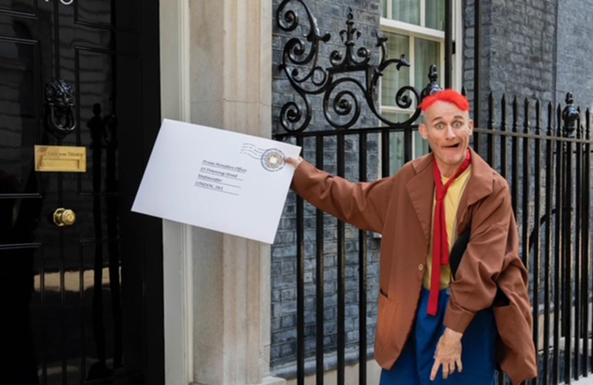 Tweedy the Clown delivering the letter to Downing Street