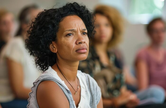 Woman at a support group. Photo: Adobe