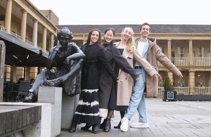 Northern Ballet dancers pose with a statue of Anne Lister in Halifax, Yorkshire. Photo: Emily Nuttall