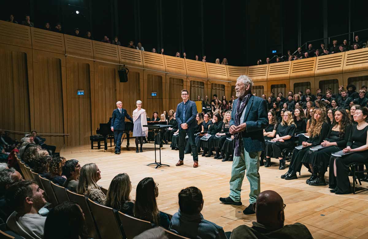 Ian McKellen announces naming of David Rowe-Beddoe Shakespeare prize on the stage at RWCMD. Photo: Kirsten McTernan