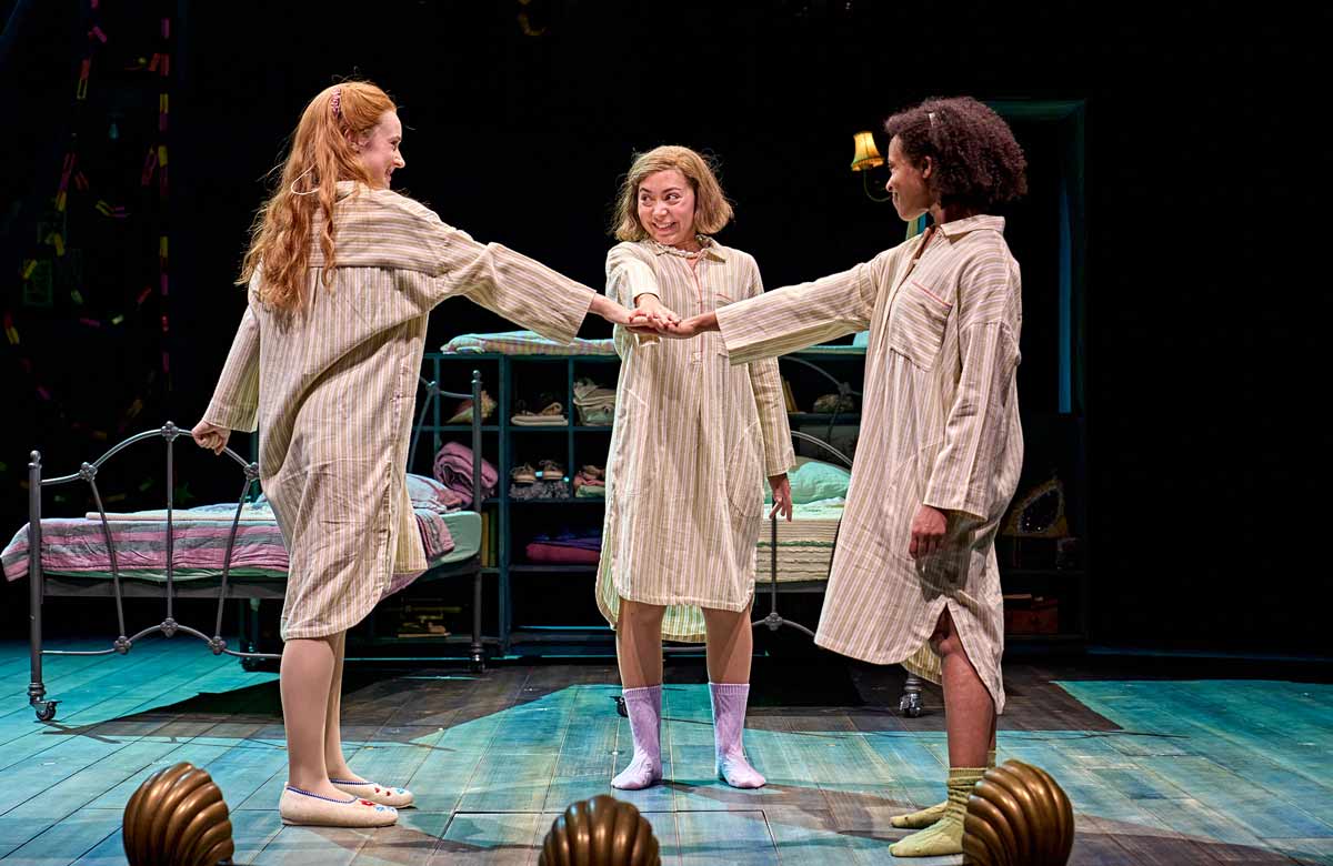 Daisy Sequerra, Yanexi Enriquez and Grace Saif in Ballet Shoes at the National Theatre, London. Photo: Manuel Harlan