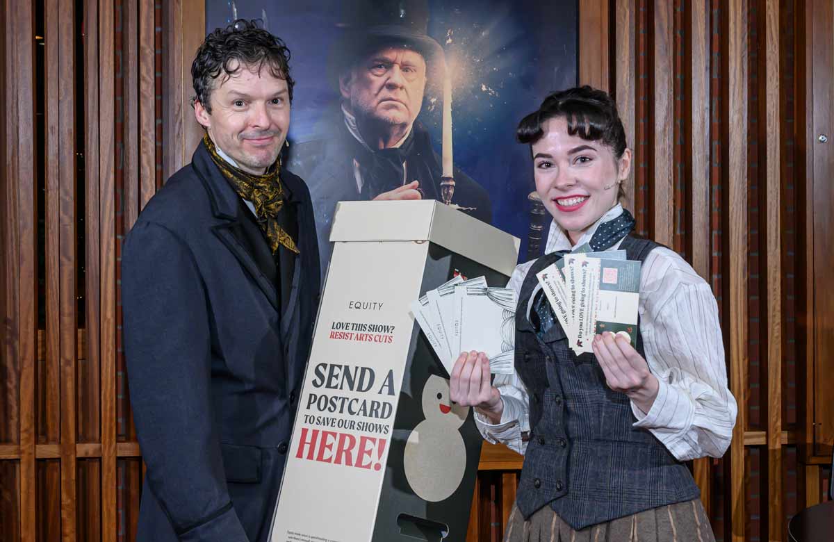 Cast members of A Christmas Carol at the Lyric Theatre with the postbox. Photo: Neil Harrison